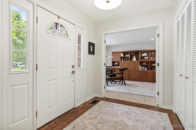 3606 E 70th Pl, Tulsa, OK 74136 - entrance foyer featuring healthy amount of natural light, baseboards, brick patterned floors, and recessed lighting