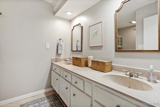 3606 E 70th Pl, Tulsa, OK 74136 - bathroom featuring tile patterned floors, double vanity, and baseboards