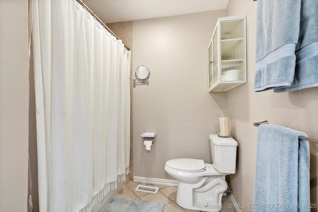 3606 E 70th Pl, Tulsa, OK 74136 - bathroom featuring tile patterned flooring, toilet, and a shower with curtain