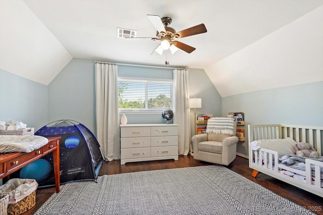 3606 E 70th Pl, Tulsa, OK 74136 - bedroom with lofted ceiling, wood finished floors, and a ceiling fan