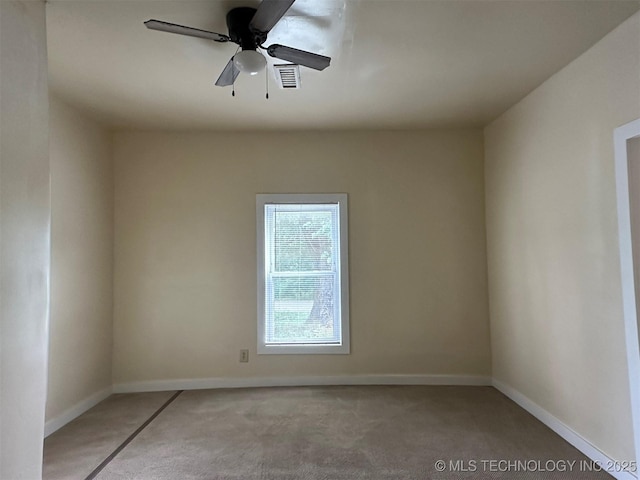 709 W Durant, Wilburton, OK 74578 - unfurnished room featuring light colored carpet, baseboards, and ceiling fan