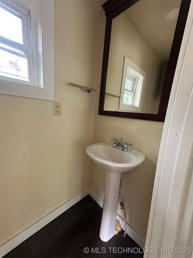 709 W Durant, Wilburton, OK 74578 - bathroom featuring baseboards and wood finished floors