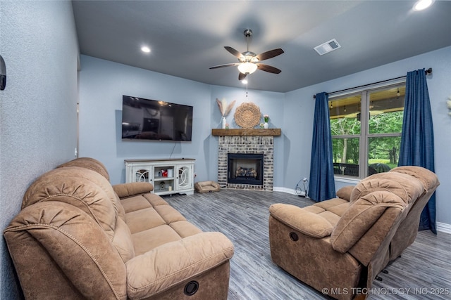 71 Rebel Ln, Durant, OK 74701 - living area with wood finished floors, ceiling fan, baseboards, a fireplace, and recessed lighting