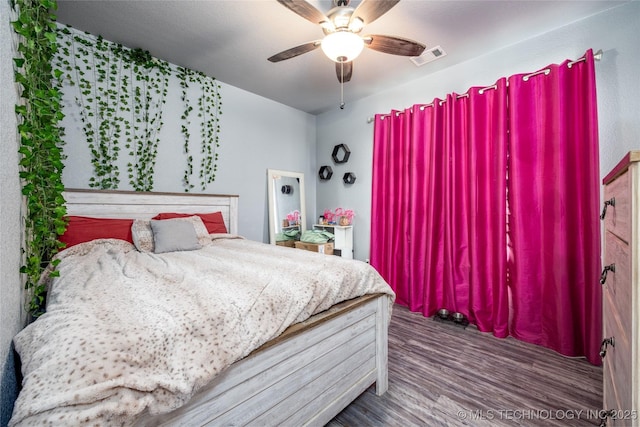 71 Rebel Ln, Durant, OK 74701 - bedroom with wood finished floors and ceiling fan