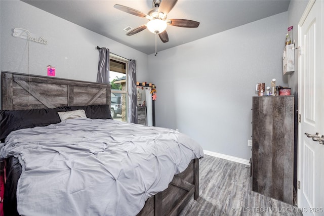 71 Rebel Ln, Durant, OK 74701 - bedroom with wood finished floors, baseboards, and a ceiling fan