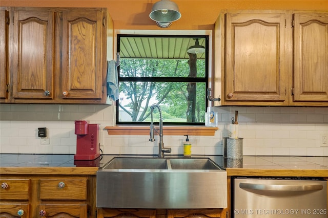 10797 S Talala Creek Ct # B, Talala, OK 74080 - kitchen with stainless steel dishwasher, backsplash, tile counters, and brown cabinets