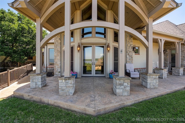 12432 Boulder Rdg, Sperry, OK 74073 - entrance to property featuring stone siding, french doors, and a patio