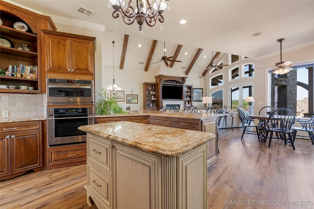 12432 Boulder Rdg, Sperry, OK 74073 - kitchen with a chandelier, a ceiling fan, open floor plan, light wood finished floors, and recessed lighting