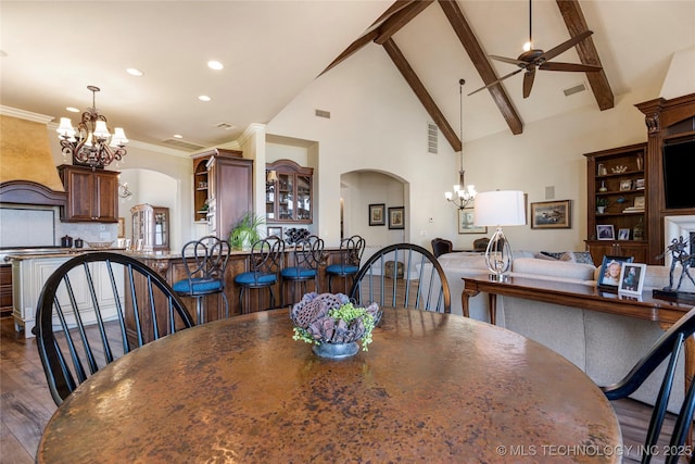 12432 Boulder Rdg, Sperry, OK 74073 - dining area with a chandelier, arched walkways, dark wood-style flooring, high vaulted ceiling, and ceiling fan