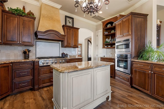 12432 Boulder Rdg, Sperry, OK 74073 - kitchen featuring custom exhaust hood, open shelves, stainless steel appliances, dark wood-style flooring, and ornamental molding