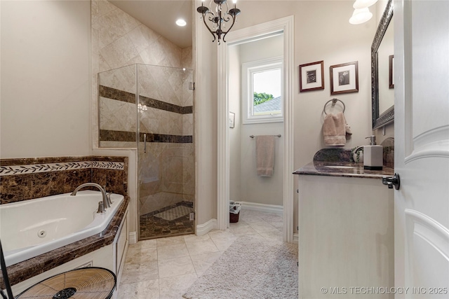 12432 Boulder Rdg, Sperry, OK 74073 - bathroom featuring a stall shower, a tub with jets, and vanity