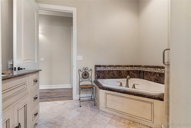 12432 Boulder Rdg, Sperry, OK 74073 - bathroom featuring vanity, a bath, and baseboards