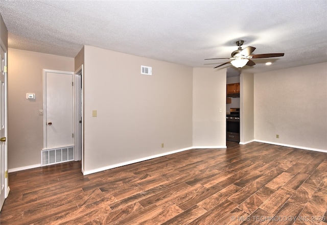 12518 E 25th St, Tulsa, OK 74129 - unfurnished room featuring ceiling fan, wood finished floors, a textured ceiling, and baseboards