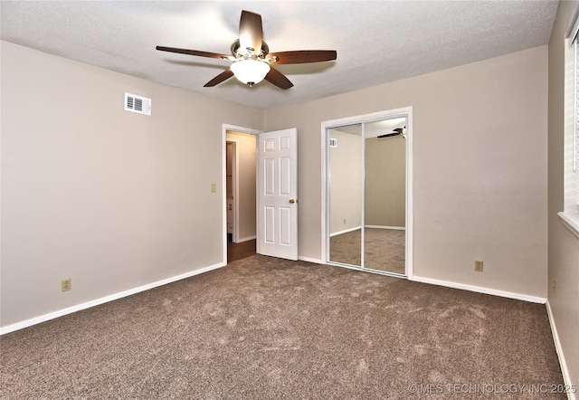 12518 E 25th St, Tulsa, OK 74129 - unfurnished bedroom featuring carpet, baseboards, a closet, a ceiling fan, and a textured ceiling