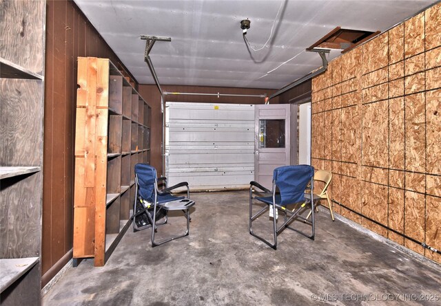 12518 E 25th St, Tulsa, OK 74129 - garage featuring wooden walls