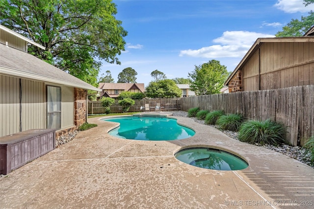 view of pool featuring an in-ground hot tub, a patio, and a fenced backyard