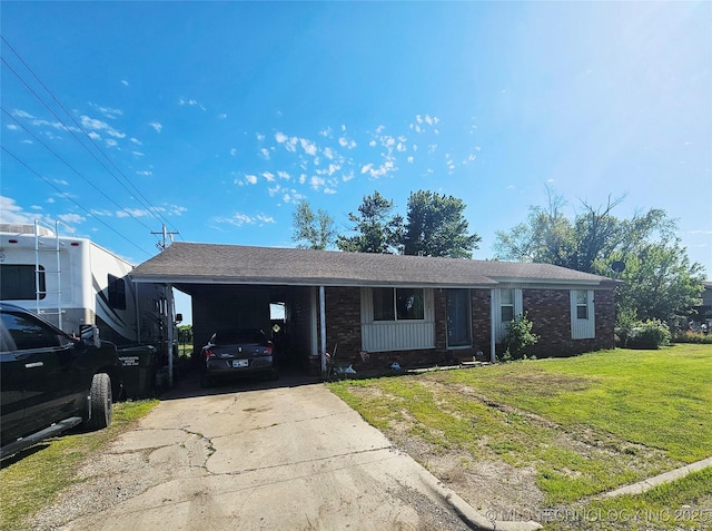 115 W Lisa Ln, Big Cabin, OK 74332 - ranch-style home featuring driveway, a front lawn, a carport, and brick siding