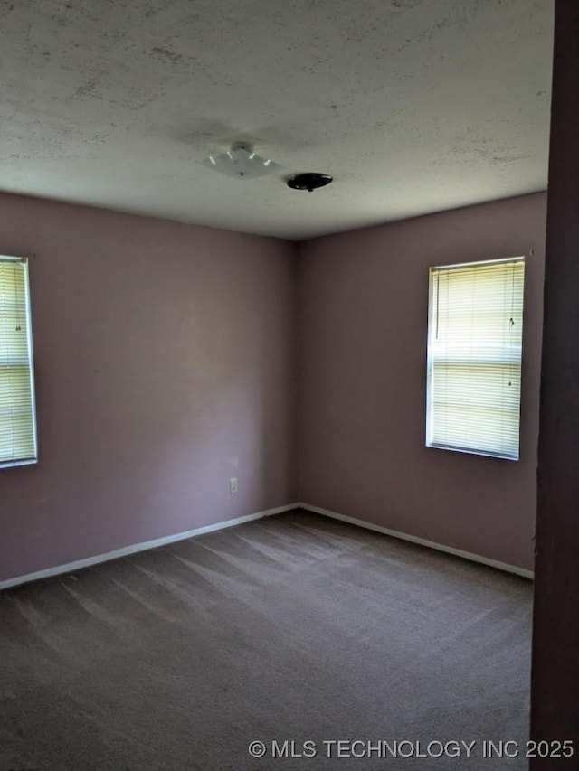 115 W Lisa Ln, Big Cabin, OK 74332 - carpeted empty room with baseboards and a textured ceiling