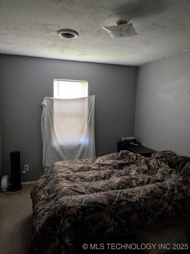 115 W Lisa Ln, Big Cabin, OK 74332 - bedroom featuring carpet floors and a textured ceiling