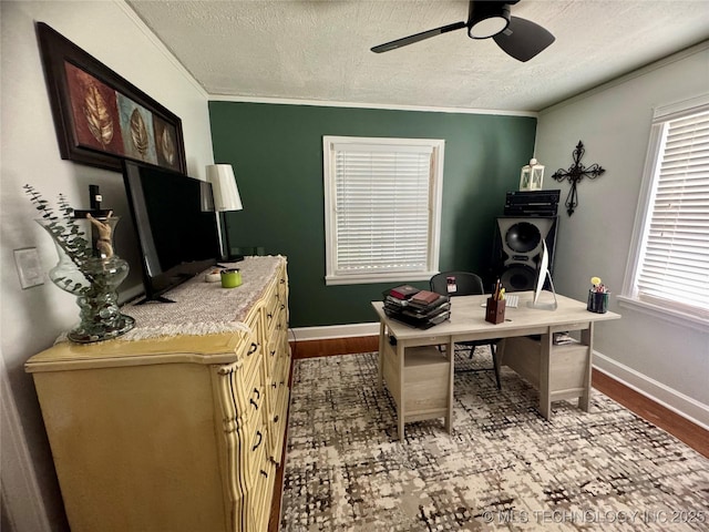 2009 S Osage Ave, Bartlesville, OK 74006 - home office with a textured ceiling, ceiling fan, wood finished floors, ornamental molding, and baseboards