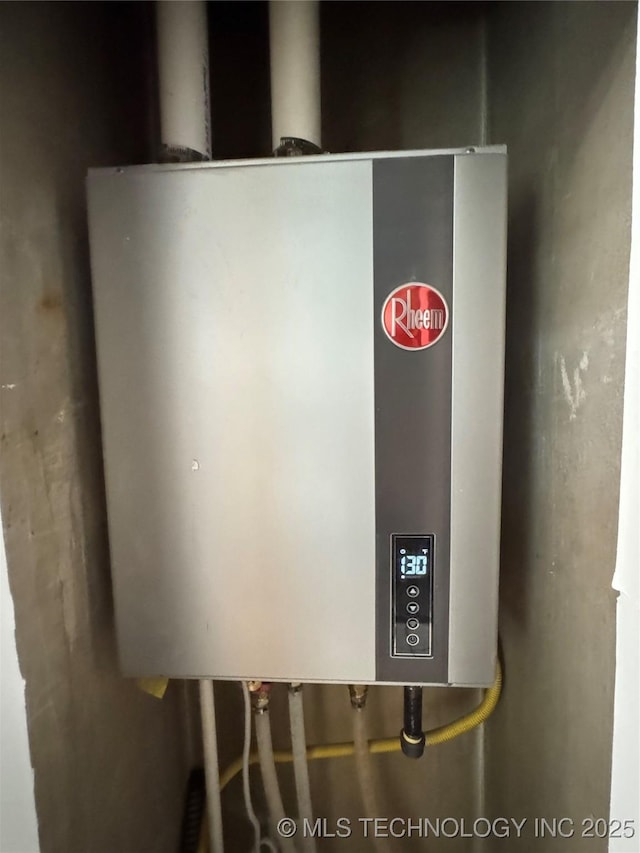 2009 S Osage Ave, Bartlesville, OK 74006 - utility room featuring tankless water heater