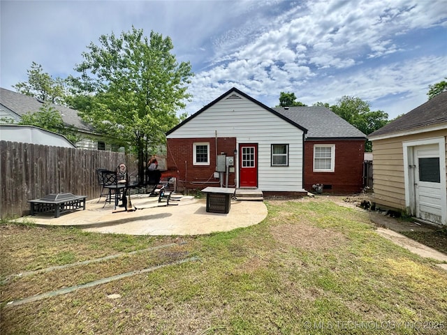 2009 S Osage Ave, Bartlesville, OK 74006 - back of house with brick siding, a patio, and crawl space