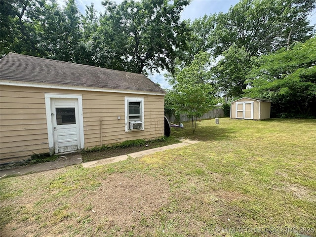 2009 S Osage Ave, Bartlesville, OK 74006 - view of yard with an outdoor structure, a storage unit, and cooling unit