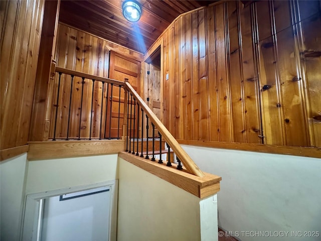 2009 S Osage Ave, Bartlesville, OK 74006 - staircase with wooden walls and wooden ceiling