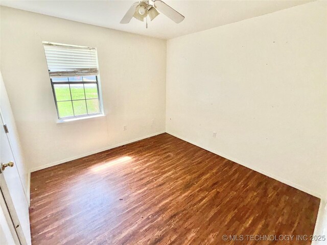 404 David Walker Ln, Stigler, OK 74462 - unfurnished room with wood finished floors, ceiling fan, and baseboards