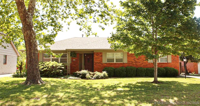 4507 S Irvington Ave, Tulsa, OK 74135 - ranch-style house with a front lawn and brick siding