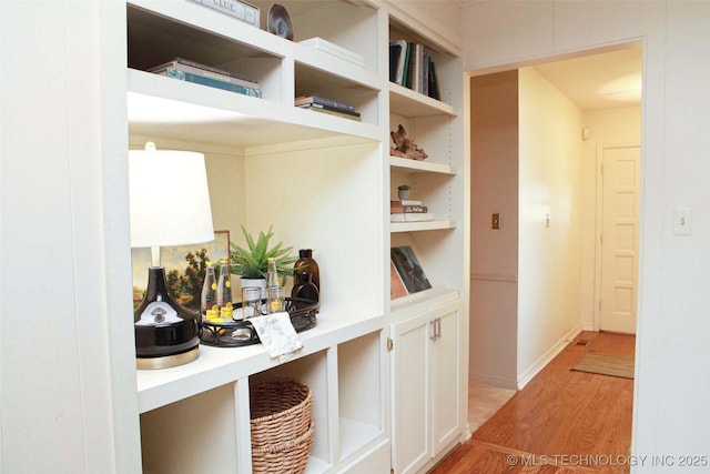 4507 S Irvington Ave, Tulsa, OK 74135 - hallway with light wood-style floors and baseboards