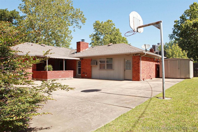 4507 S Irvington Ave, Tulsa, OK 74135 - back of property with a shed, brick siding, a chimney, an outdoor structure, and a patio area