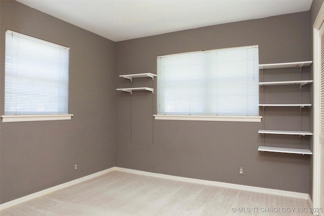 4507 S Irvington Ave, Tulsa, OK 74135 - carpeted empty room featuring baseboards and plenty of natural light