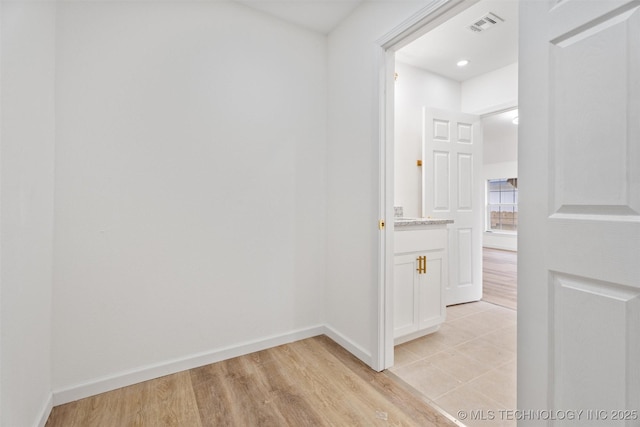 3919 E Archer St, Tulsa, OK 74115 - hallway with baseboards and light wood finished floors