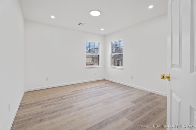 3919 E Archer St, Tulsa, OK 74115 - spare room featuring light wood-type flooring and recessed lighting