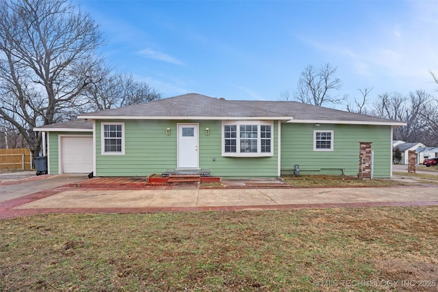 3919 E Archer St, Tulsa, OK 74115 - view of front of house featuring a garage and concrete driveway