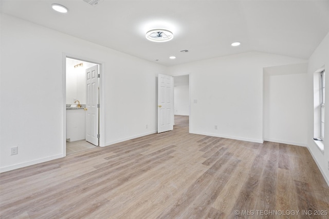 3919 E Archer St, Tulsa, OK 74115 - unfurnished bedroom featuring light wood-type flooring, recessed lighting, and vaulted ceiling
