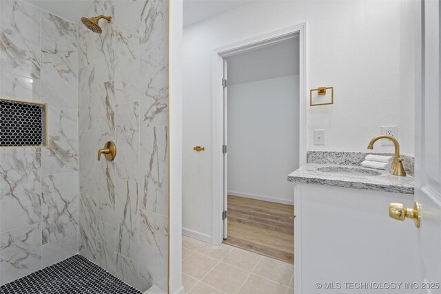 3919 E Archer St, Tulsa, OK 74115 - full bath featuring vanity, a marble finish shower, and tile patterned floors