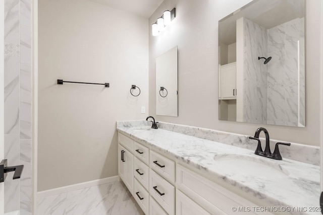 2847 E 141st Ct S, Bixby, OK 74008 - full bathroom featuring marble look tile flooring, baseboards, double vanity, and a shower