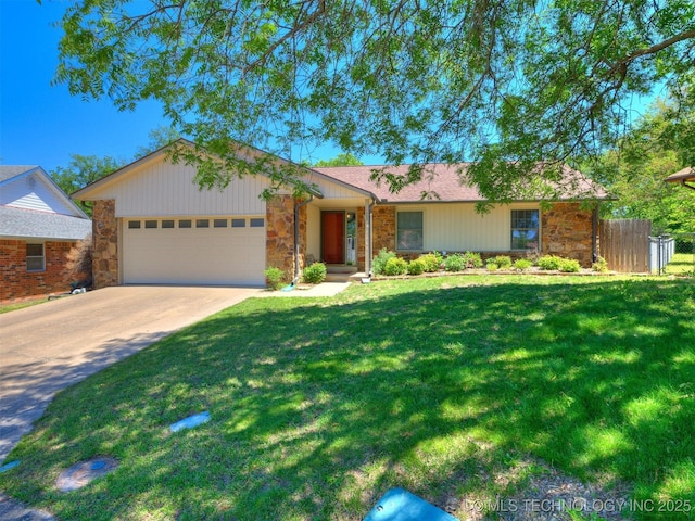 124 Canterbury Ct, Bartlesville, OK 74006 - ranch-style house featuring stone siding, a garage, and driveway