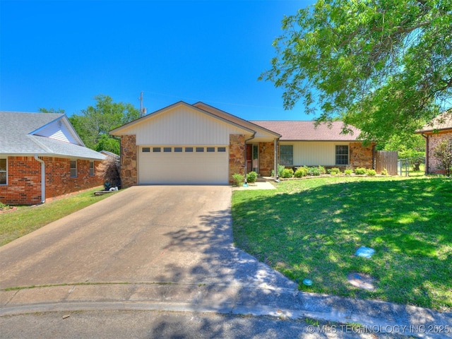 124 Canterbury Ct, Bartlesville, OK 74006 - single story home featuring a garage, driveway, and stone siding