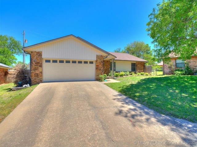 124 Canterbury Ct, Bartlesville, OK 74006 - ranch-style house featuring stone siding, concrete driveway, and an attached garage