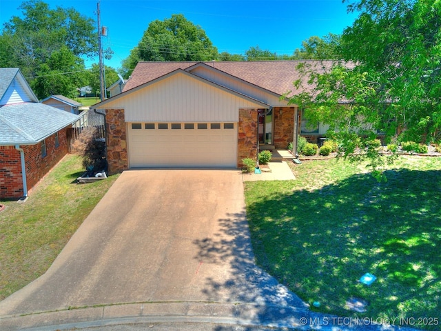 124 Canterbury Ct, Bartlesville, OK 74006 - view of front of property with stone siding, an attached garage, concrete driveway, a front lawn, and a shingled roof