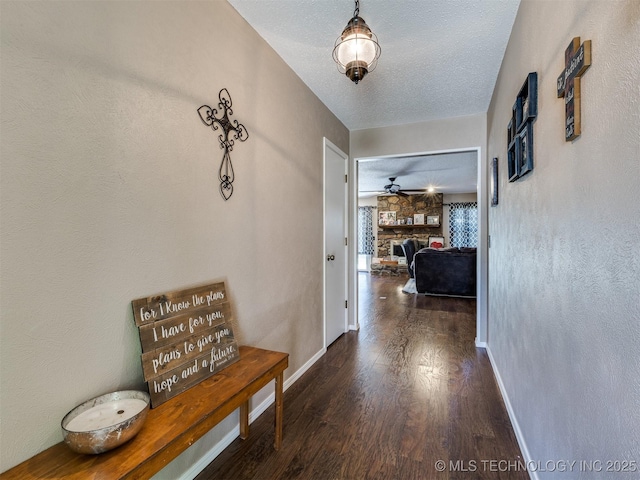 124 Canterbury Ct, Bartlesville, OK 74006 - corridor with wood finished floors, baseboards, and a textured ceiling