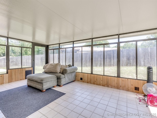 124 Canterbury Ct, Bartlesville, OK 74006 - sunroom / solarium featuring wood walls, tile patterned flooring, and plenty of natural light