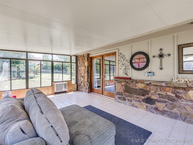 124 Canterbury Ct, Bartlesville, OK 74006 - living area with tile patterned flooring, french doors, a decorative wall, and a wall mounted air conditioner