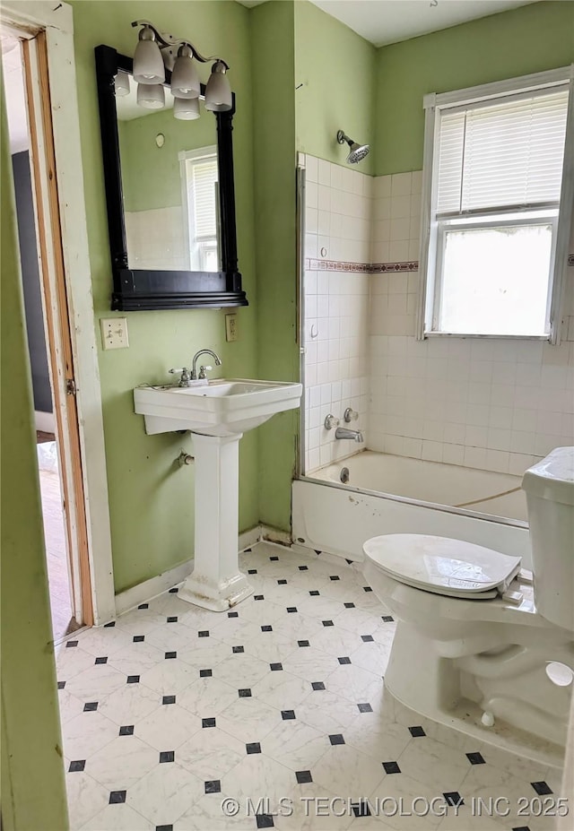 500 S Kern St, Okmulgee, OK 74447 - bathroom featuring toilet,  shower combination, and baseboards
