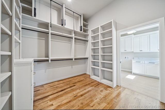 682 W 113th Ct S, Jenks, OK 74037 - walk in closet featuring light wood finished floors