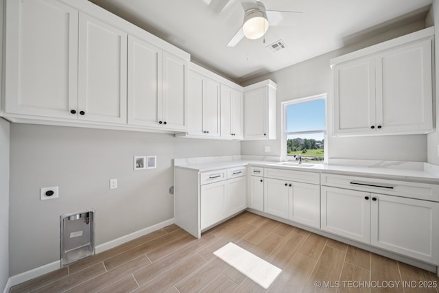 682 W 113th Ct S, Jenks, OK 74037 - laundry room featuring cabinet space, light wood-style floors, ceiling fan, electric dryer hookup, and hookup for a washing machine