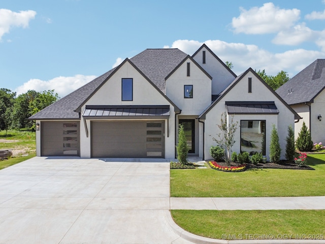 682 W 113th Ct S, Jenks, OK 74037 - view of front of property with stucco siding, a standing seam roof, driveway, and a front yard